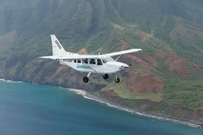A white sightseeing plane over the Na Pali Coast